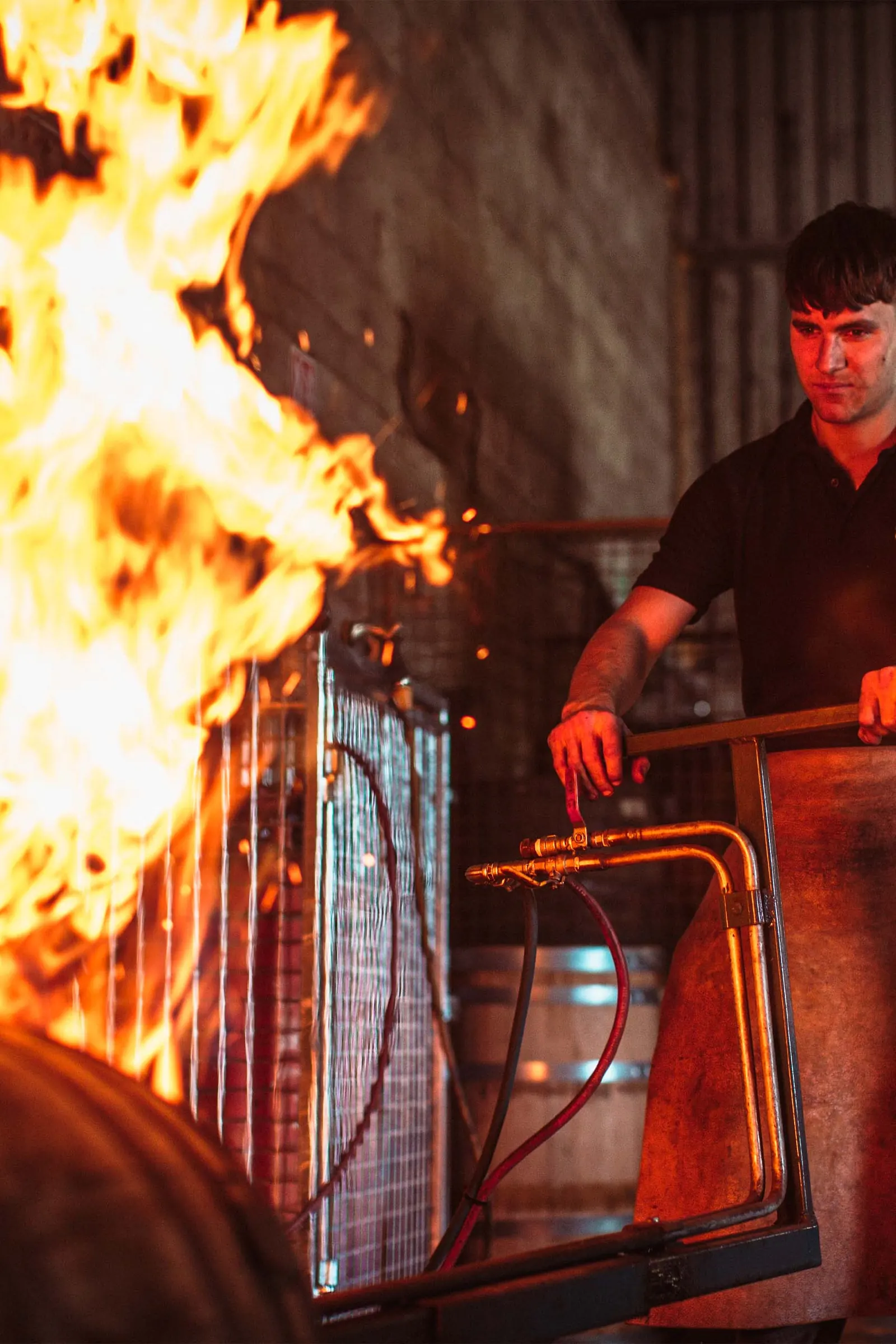 Re-charring casks over open flame — Dair Nua Cooperage, Foxford, Co. Mayo
